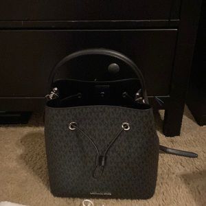Michael kors backpack and bucket purse.